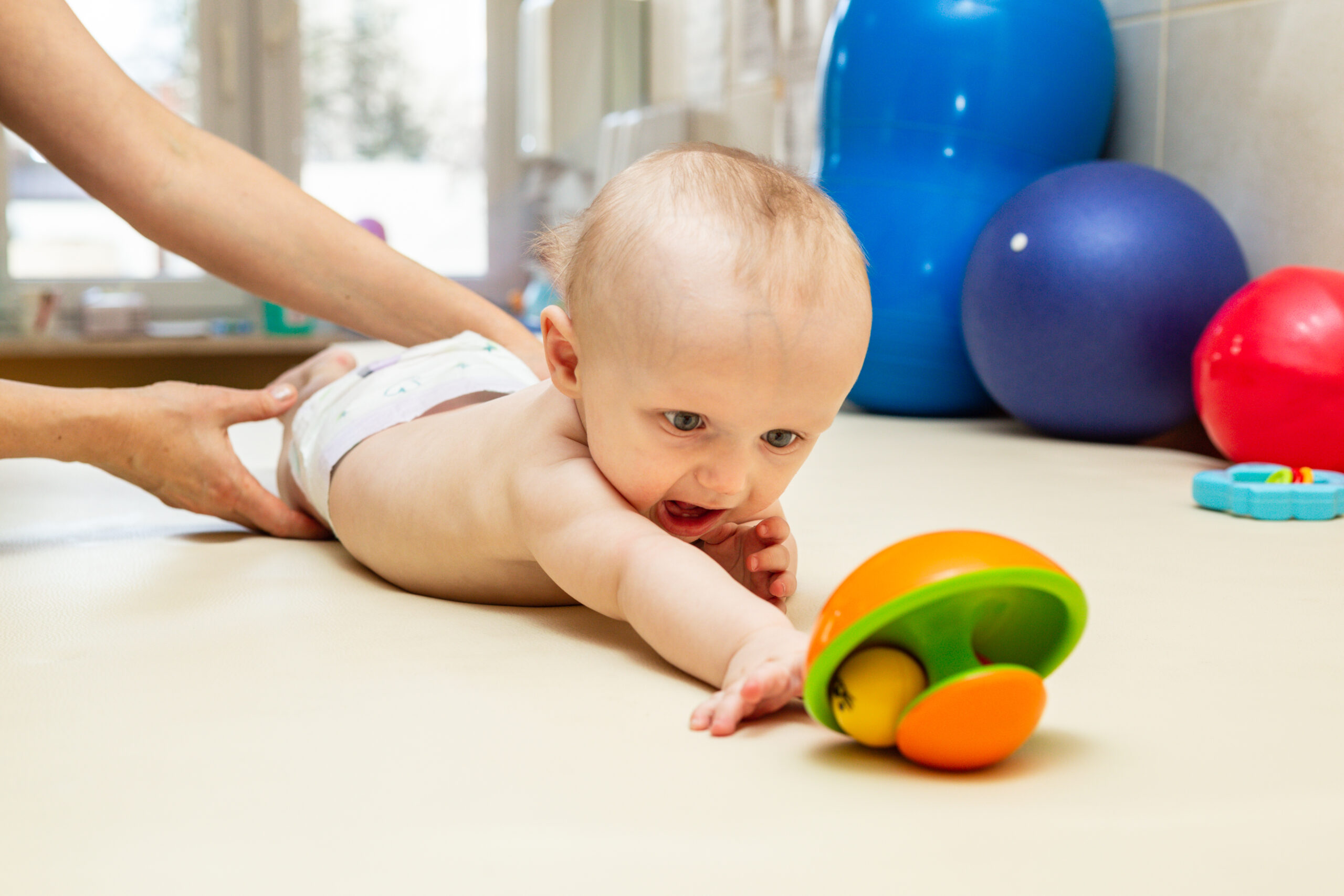 Pediatric,Physical,Therapy,-,An,Infant,Exercising,On,A,Table